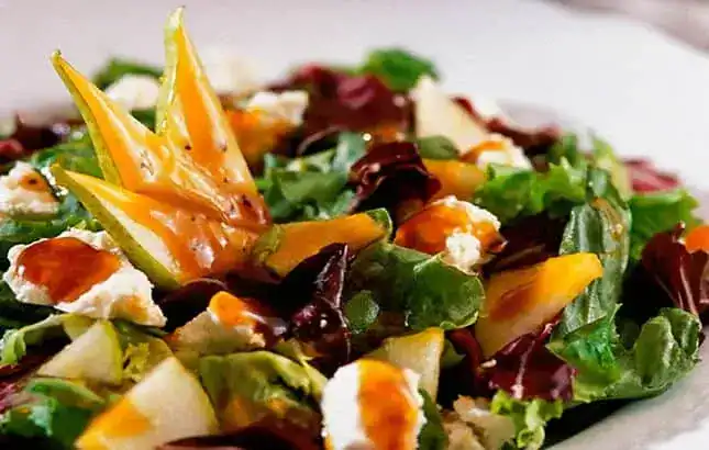 dining3-1-1 | Greenwood Beach Resort, Cat Island, Bahamas Colorful mixed-greens salad with mango slices, feta cheese, and fresh herbs.